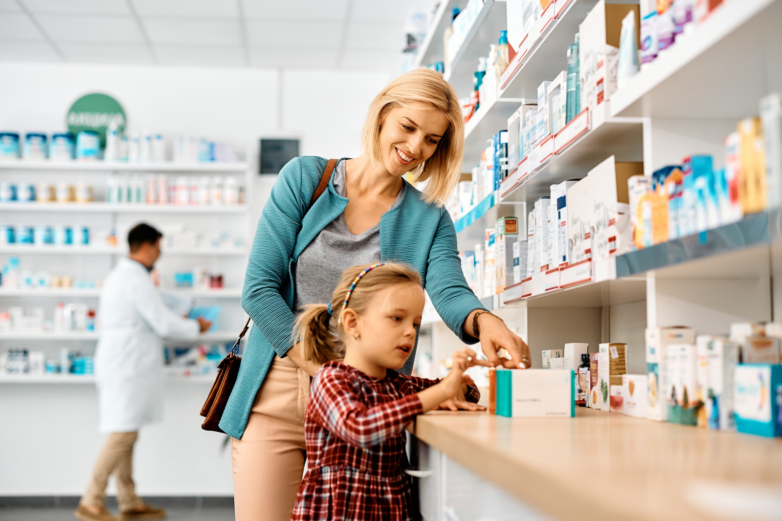 Woman looking at medications with daughter
