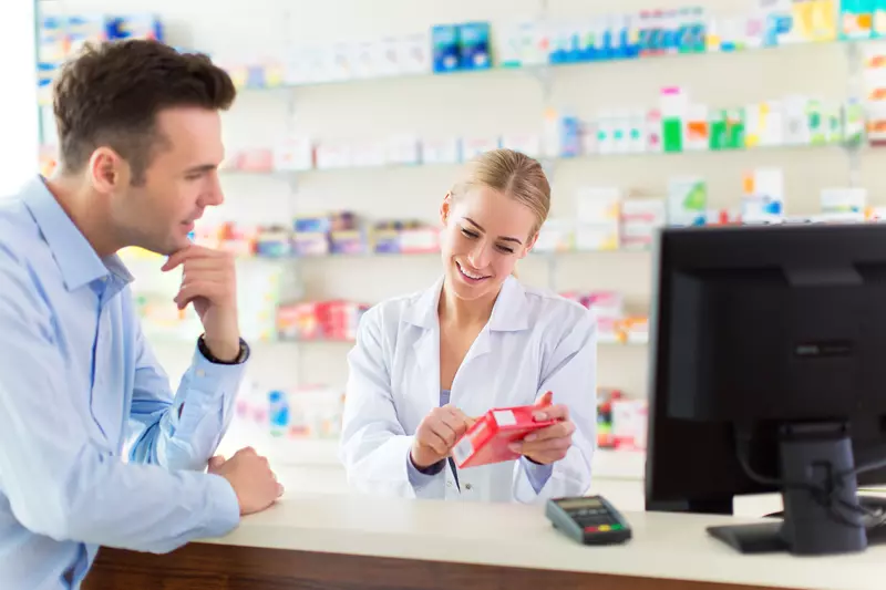 pharmacist explaining medication to patient