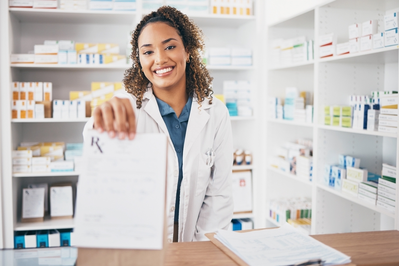 pharmacist with bag of medication